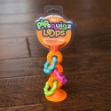 Fat Brain Toy Bobo Przyssawki Grzechotka Pomarańczowa. PipSquigz Loops.