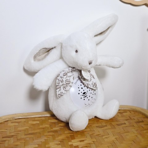 DOUDOU - lampka projektor muzyczny króliczek Lapin Doudou Projection, Doudou et Compagnie, 19 cm, biały